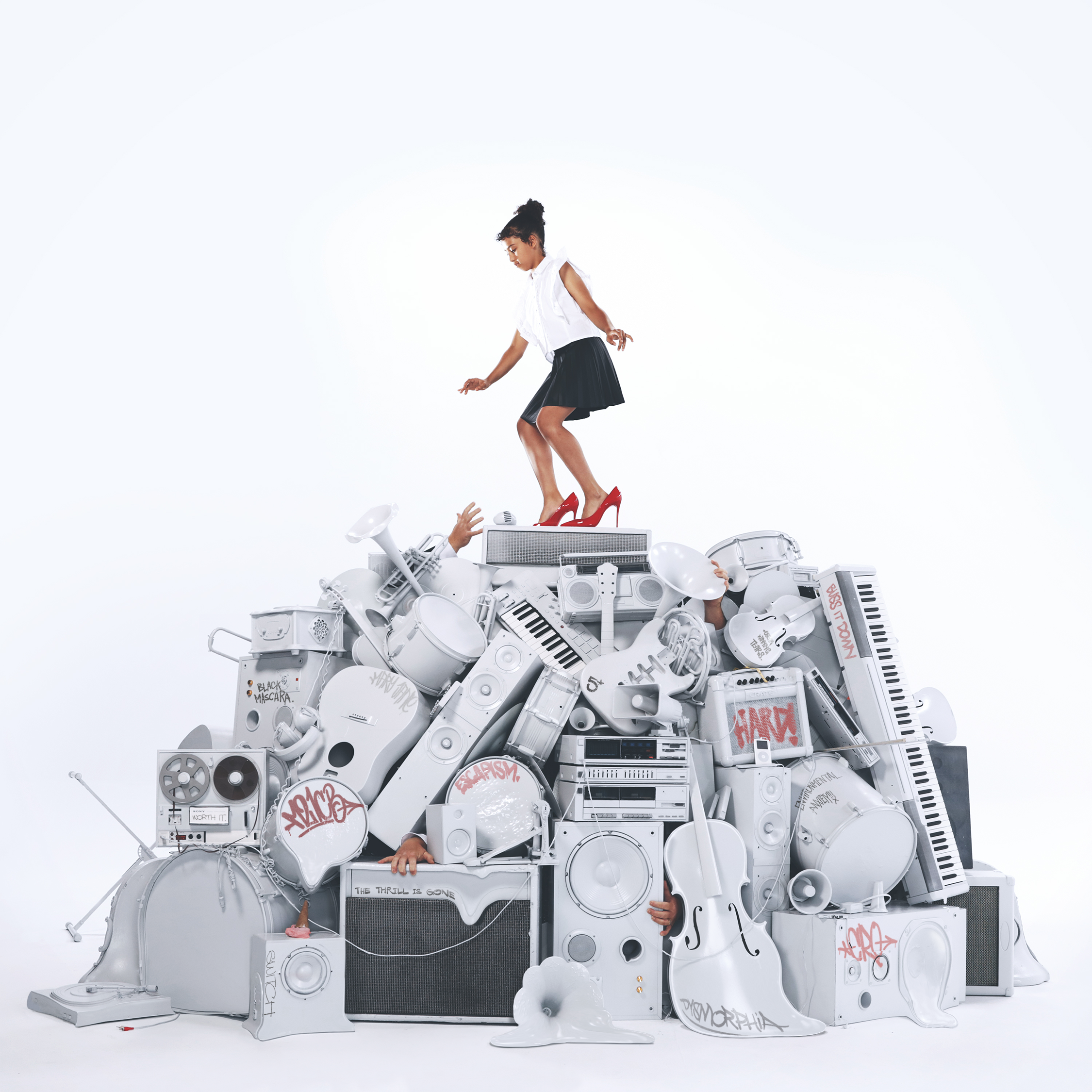Small girl on pile of white instruments
