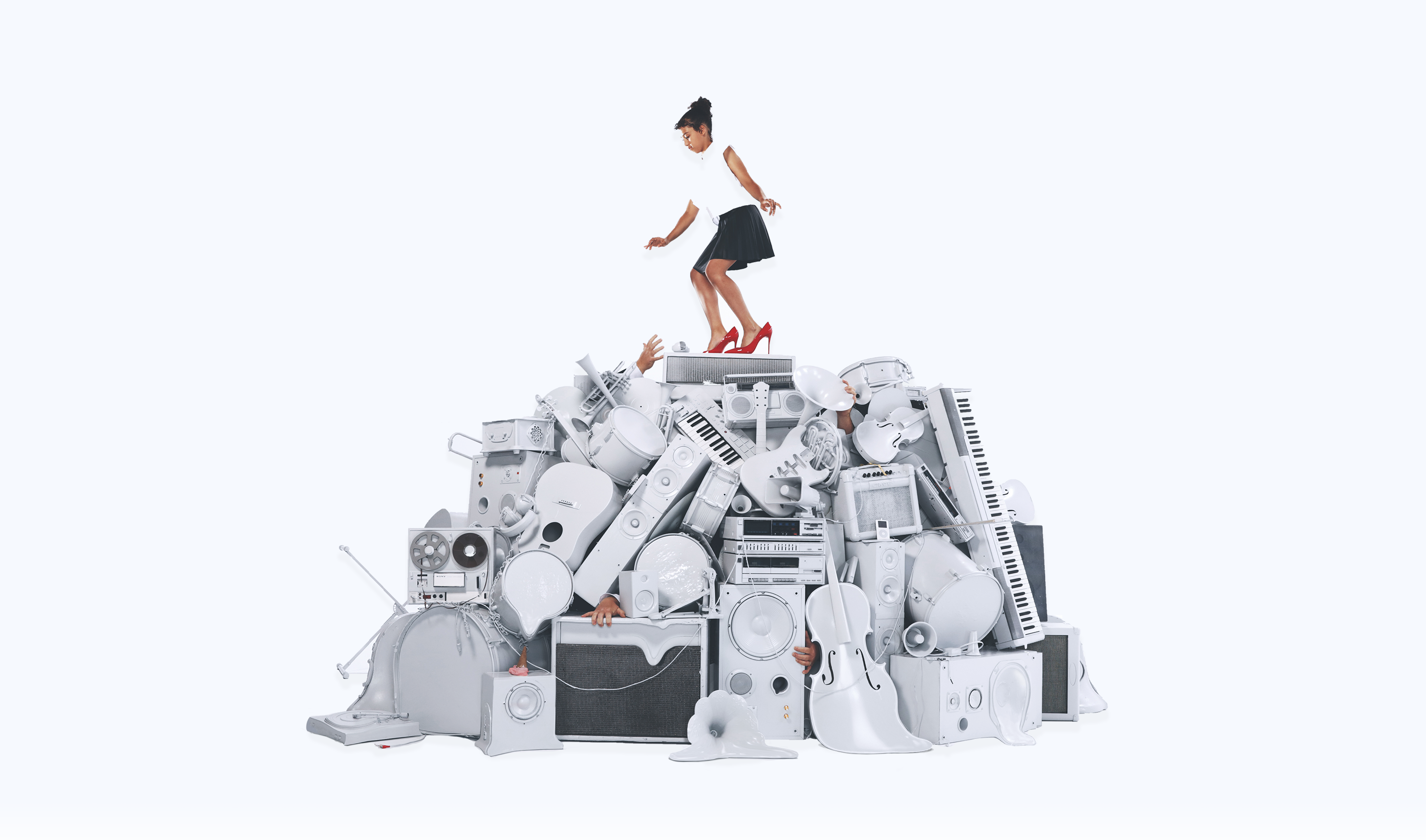 Small girl on pile of white instruments